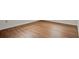 Close up of wood-look flooring and white trim in a home at 1170 E Bay St, Winter Garden, FL 34787