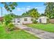 Charming single-story home with well-maintained lawn and a concrete driveway leading to the front door at 1170 E Bay St, Winter Garden, FL 34787