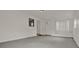 Large living room featuring concrete floors and neutral colored walls at 1170 E Bay St, Winter Garden, FL 34787