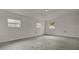 Spacious living room with neutral walls, concrete floors and natural light at 1170 E Bay St, Winter Garden, FL 34787