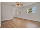 Spacious living area with hardwood floors, large windows, and natural light, providing a comfortable living space at 1170 E Bay St, Winter Garden, FL 34787