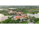 Community aerial view showcasing the terracotta rooftops, lush landscaping, and tranquil waterways at 118 Ventana Dr, Kissimmee, FL 34759