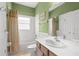 Bathroom with tub, shower and vanity with wood cabinets and a white countertop at 118 Ventana Dr, Kissimmee, FL 34759