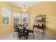Cozy breakfast nook with a glass table, ornate chairs, and lots of natural light at 118 Ventana Dr, Kissimmee, FL 34759