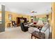 Spacious living room featuring tile floors, neutral furniture, and an open layout at 118 Ventana Dr, Kissimmee, FL 34759