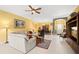 Open-concept living room with tile floors, bright yellow walls, and plenty of natural light at 118 Ventana Dr, Kissimmee, FL 34759