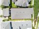 Aerial view of the roof, backyard, and surrounding neighborhood; the property sits among palm trees and green spaces at 13334 Beebe Aly, Orlando, FL 32827