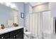 Bathroom featuring granite countertops, modern fixtures, and shower/tub combo at 13334 Beebe Aly, Orlando, FL 32827