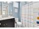 Bright bathroom with a stylish vanity, a toilet, and a shower-tub combo at 13334 Beebe Aly, Orlando, FL 32827
