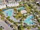 Aerial view of the community pool area featuring multiple pools, lounging areas, and recreational facilities at 13334 Beebe Aly, Orlando, FL 32827
