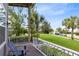 Inviting front porch perfect for relaxing; it overlooks the landscaped front yard with mature trees at 13334 Beebe Aly, Orlando, FL 32827