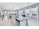 Bright kitchen island with granite countertops flows into the dining and living areas with ample windows at 13334 Beebe Aly, Orlando, FL 32827