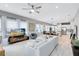 Bright open-concept living room with a modern design and plank flooring throughout the main floor at 13334 Beebe Aly, Orlando, FL 32827