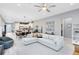 Open-concept living room featuring modern decor and seamlessly flows into the dining and kitchen areas at 13334 Beebe Aly, Orlando, FL 32827