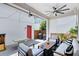 Inviting outdoor patio with comfortable seating, ceiling fan, and decorative string lights at 13334 Beebe Aly, Orlando, FL 32827