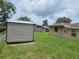 Fenced backyard with shed at 1335 Cr 442, Lake Panasoffkee, FL 33538