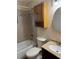 Bathroom with a tub, a toilet, and a vanity with a sink and mirror at 1335 Cr 442, Lake Panasoffkee, FL 33538