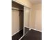 Bedroom closet with a mirrored door and storage system at 1335 Cr 442, Lake Panasoffkee, FL 33538