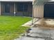 Close up of home exterior featuring garage and well maintained lawn at 1335 Cr 442, Lake Panasoffkee, FL 33538