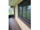 Inviting front porch featuring screened entry door and fresh paint at 1335 Cr 442, Lake Panasoffkee, FL 33538