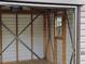 This shed features wood framing and metal supports at 1335 Cr 442, Lake Panasoffkee, FL 33538
