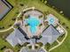 Overhead view of a community pool area, showing the pool design, lounge areas, and surrounding landscaping at 13461 Panama Beach Ct, Orlando, FL 32827