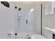 Modern bathroom featuring glass enclosed shower with sleek fixtures, white tile, and toilet at 13461 Panama Beach Ct, Orlando, FL 32827