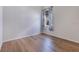 Bedroom with hardwood floors, neutral walls, white baseboards, and blue patterned curtains at 13461 Panama Beach Ct, Orlando, FL 32827