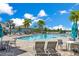 A community pool with plenty of lounge chairs in a beautiful neighborhood at 13461 Panama Beach Ct, Orlando, FL 32827