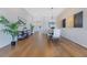 Open dining area with wood floors, complemented by modern decor and natural light at 13461 Panama Beach Ct, Orlando, FL 32827