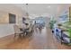 Spacious dining room with hardwood floors and modern chandelier fixture at 13461 Panama Beach Ct, Orlando, FL 32827
