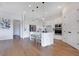 Open kitchen boasts ample white cabinetry, stainless appliances, and a stylish island at 13461 Panama Beach Ct, Orlando, FL 32827