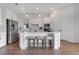 Modern kitchen features stainless steel appliances, white cabinets, and a center island with seating at 13461 Panama Beach Ct, Orlando, FL 32827