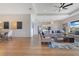 Open-concept living area, perfect for entertaining, with wood floors and plenty of natural light at 13461 Panama Beach Ct, Orlando, FL 32827