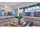 Cozy living room showcasing comfortable seating and scenic views through a large window at 13461 Panama Beach Ct, Orlando, FL 32827