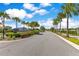 Entrance to Isles of Lake Nona with lush landscaping and palm trees at 13461 Panama Beach Ct, Orlando, FL 32827