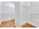 Walk-in closet featuring wooden floors and wire shelving at 13461 Panama Beach Ct, Orlando, FL 32827