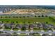 Aerial view of a neighborhood featuring a highway, green space, and houses at 144 Williamson Dr, Davenport, FL 33897