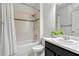 Well-lit bathroom with shower-tub combo, and decorative tile accents at 144 Williamson Dr, Davenport, FL 33897