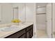 Bathroom featuring a double sink vanity with framed mirror, adjacent to a tub and shower at 144 Williamson Dr, Davenport, FL 33897