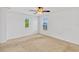 Bedroom with carpet and two windows that provide natural light, complemented by a ceiling fan at 144 Williamson Dr, Davenport, FL 33897
