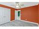 Bedroom featuring wood-style floors, ceiling fan, and a closet at 144 Williamson Dr, Davenport, FL 33897