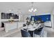 Bright and open living room with modern furnishings and dining table at 144 Williamson Dr, Davenport, FL 33897