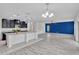 Bright and open living room with modern furnishings, kitchen in background at 144 Williamson Dr, Davenport, FL 33897