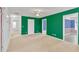 Spacious room with neutral carpet, white trim, and bright green walls at 144 Williamson Dr, Davenport, FL 33897