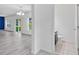 Open-concept living room features sliding glass doors and durable flooring, perfect for modern living at 144 Williamson Dr, Davenport, FL 33897