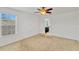 Primary bedroom with carpet, large window, and a view of the en suite at 144 Williamson Dr, Davenport, FL 33897