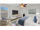 Comfortable primary bedroom featuring a TV and relaxing decor at 144 Williamson Dr, Davenport, FL 33897