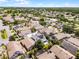 Neighborhood featuring single-Gathering homes with well-kept landscaping and screened-in pools, captured in a sunny aerial shot at 14423 Tambourine Dr, Orlando, FL 32837
