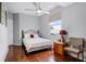 Bedroom with a bed, a ceiling fan, and a window at 14423 Tambourine Dr, Orlando, FL 32837